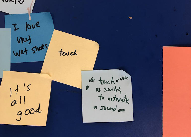 Several sticky notes with notes on dark blue background